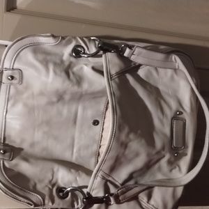 Nice shoulder bag as you see there's a tear where zipper is little not to notica